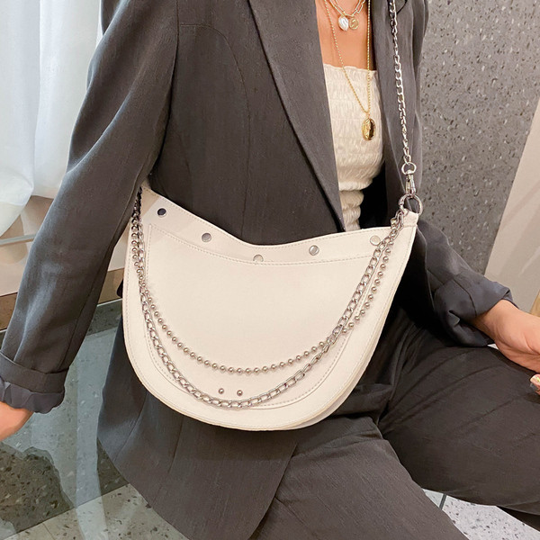 Stílusos női táska sima modell fűzőlyukakkal