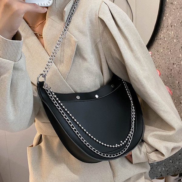 Stílusos női táska sima modell fűzőlyukakkal