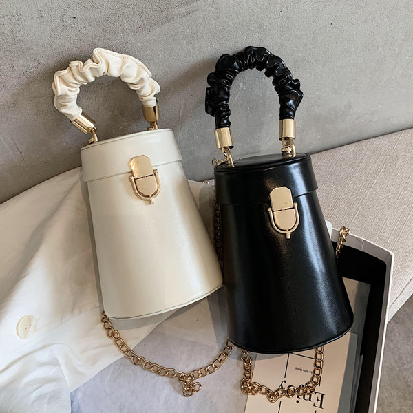 Stiilne metallist sangaga ümara kujuga naistekott