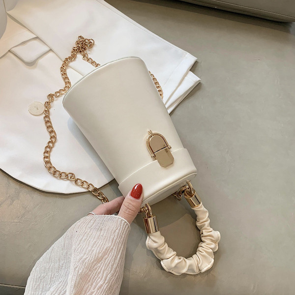 Stiilne metallist sangaga ümara kujuga naistekott