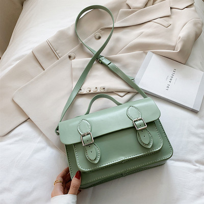 Modern női táska csatokkal és két füllel