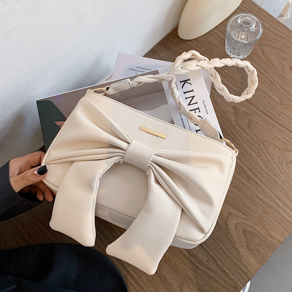 Női alkalmi táska hosszú füllel, öko bőrből