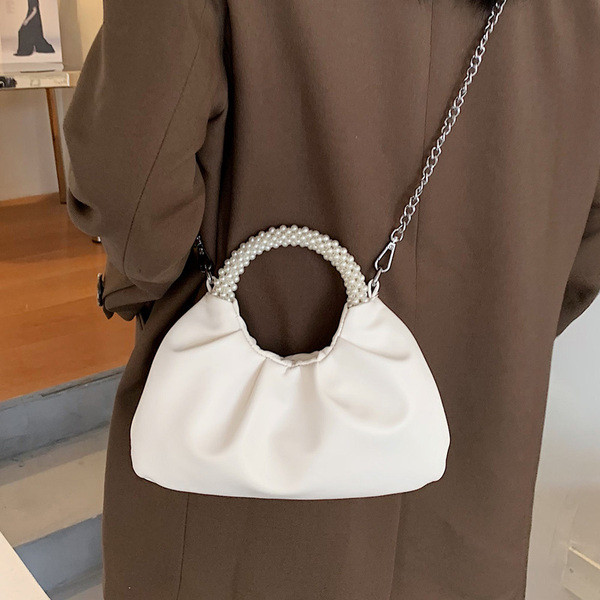 Stílusos női táska sima modell díszgyöngyökkel