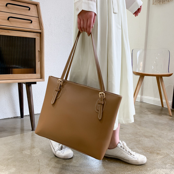 Öko-nahast stiilne õhukeste sangadega naistekott