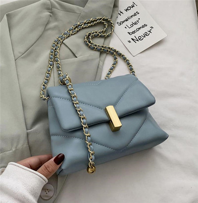 Väike metallist käepidemega nahast õlakott