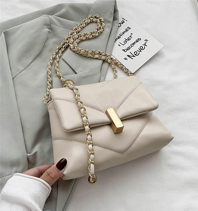 Väike metallist käepidemega nahast õlakott