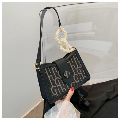 Μοντέρνα γυναικεία τσάντα από οικολογικό δέρμα με πέρλες