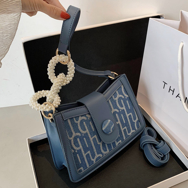 Μοντέρνα γυναικεία τσάντα από οικολογικό δέρμα με πέρλες