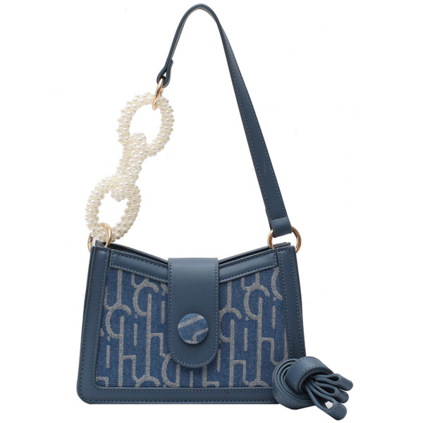 Μοντέρνα γυναικεία τσάντα από οικολογικό δέρμα με πέρλες