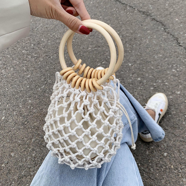 Γυναικεία μίνι πλεκτή τσάντα με στρογγυλές λαβές