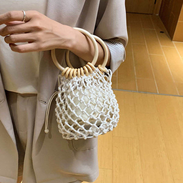 Γυναικεία μίνι πλεκτή τσάντα με στρογγυλές λαβές