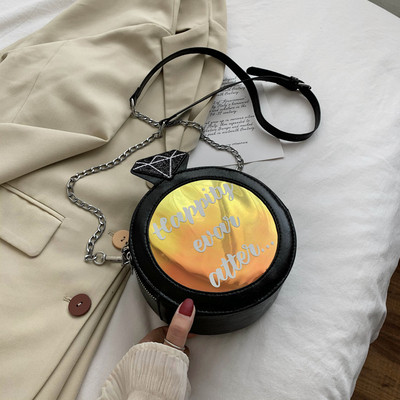 Γυναικεία στρογγυλή τσάντα από οικολογικό δέρμα με επιγραφή