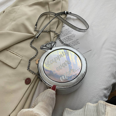 Γυναικεία στρογγυλή τσάντα από οικολογικό δέρμα με επιγραφή