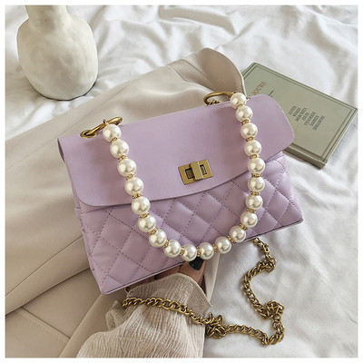 Κομψή γυναικεία τσάντα από οικολογικό δέρμα με διακοσμητικές πέρλες