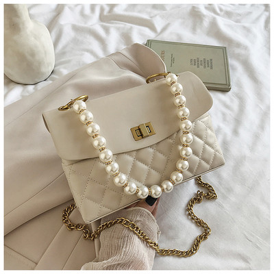 Κομψή γυναικεία τσάντα από οικολογικό δέρμα με διακοσμητικές πέρλες