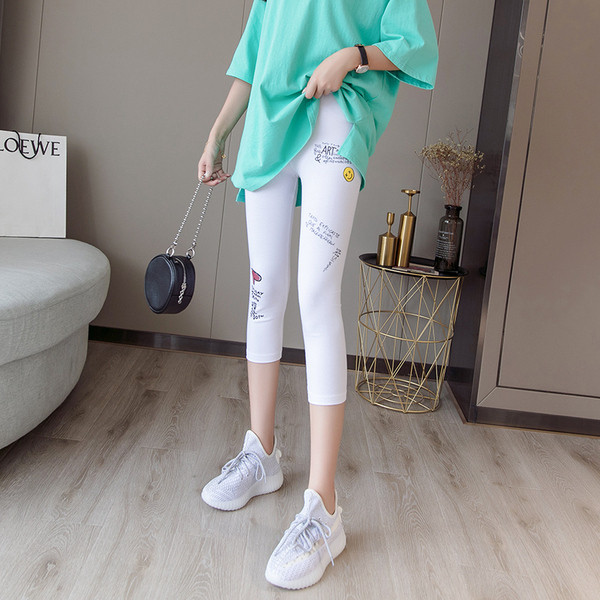 Ženske sportske tajice dužine 7/8 s aplikacijama