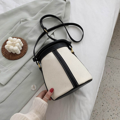 Γυναικεία στρογγυλή τσάντα με μακριά λαβή