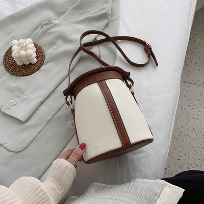 Γυναικεία στρογγυλή τσάντα με μακριά λαβή