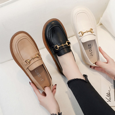 Casual women`s leather moccasins with metal element