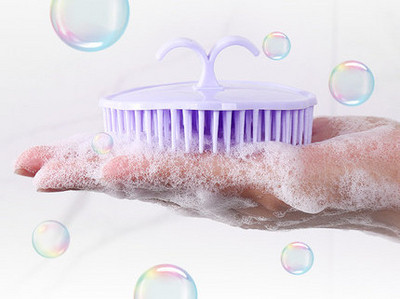 Silicone scalp brush with massaging and cleansing effect