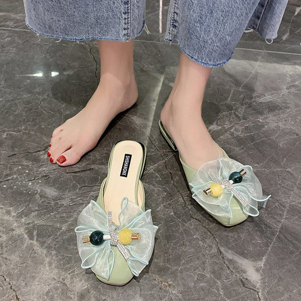 Papuci moderni de damă cu talpă plată și element panglică