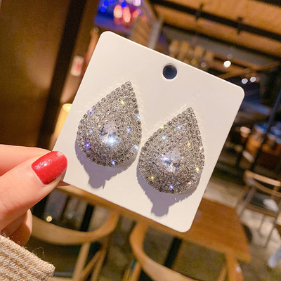 Eleganti ar akmeņiem apvilkti auskari - divi modeļi