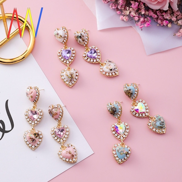 Cercei de damă suspendați în formă de inimă