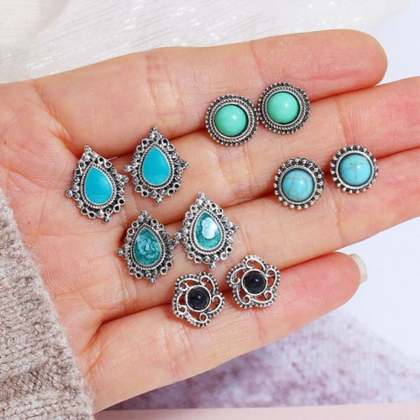 Četru sieviešu auskaru komplekts ar akmeni