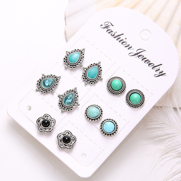 Četru sieviešu auskaru komplekts ar akmeni