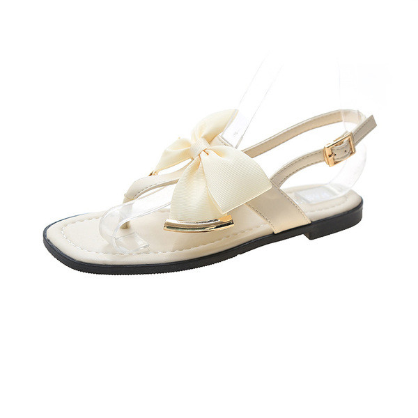 Stílusos női szandál lapos talppal és szalaggal