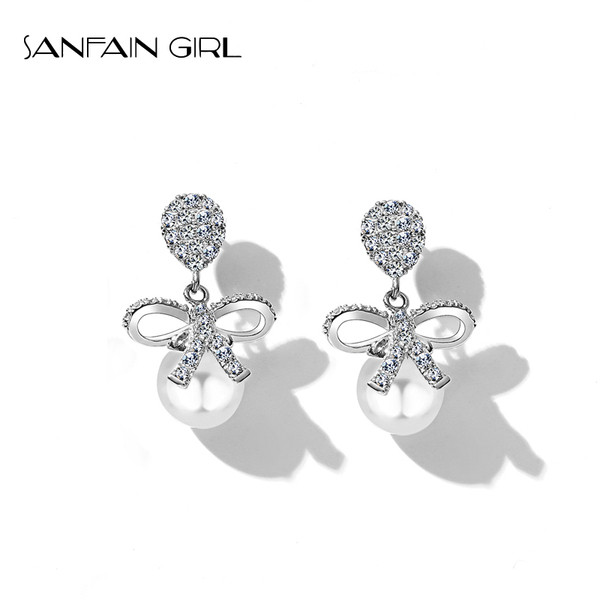 Női fülbevaló szalaggal és gyönggyel