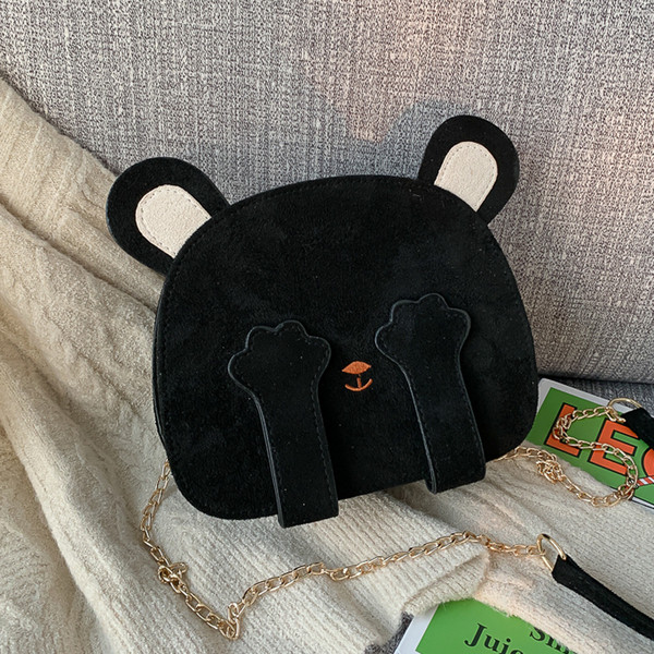 Aktuális női táska kerek formában, hosszú füllel