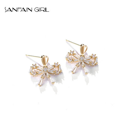 Egyszerű női fülbevaló kövekkel díszített szalag formájú