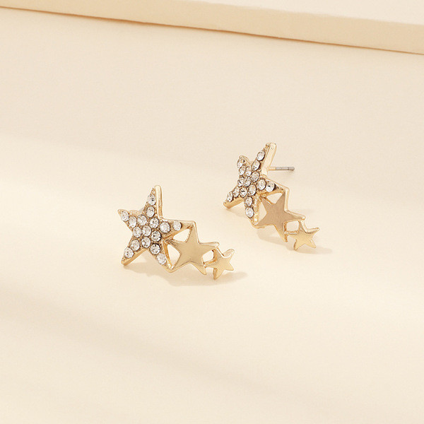 Modern női fülbevaló három csillaggal és kövekkel