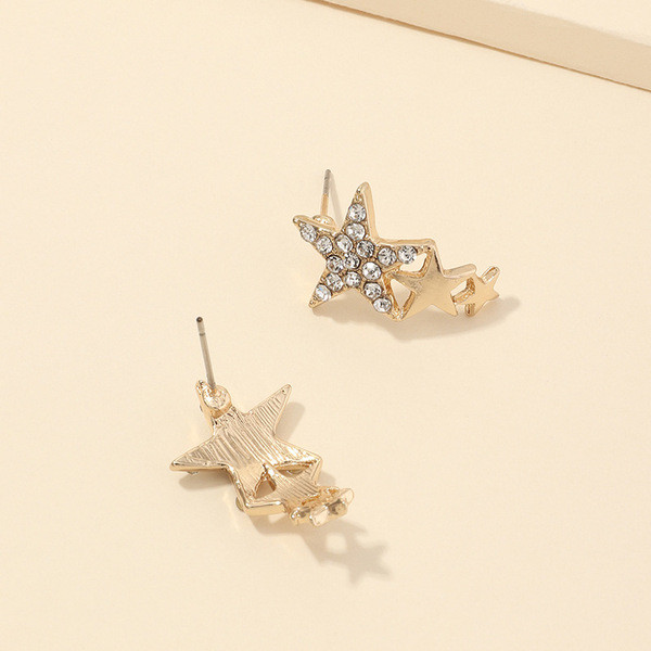 Modern női fülbevaló három csillaggal és kövekkel