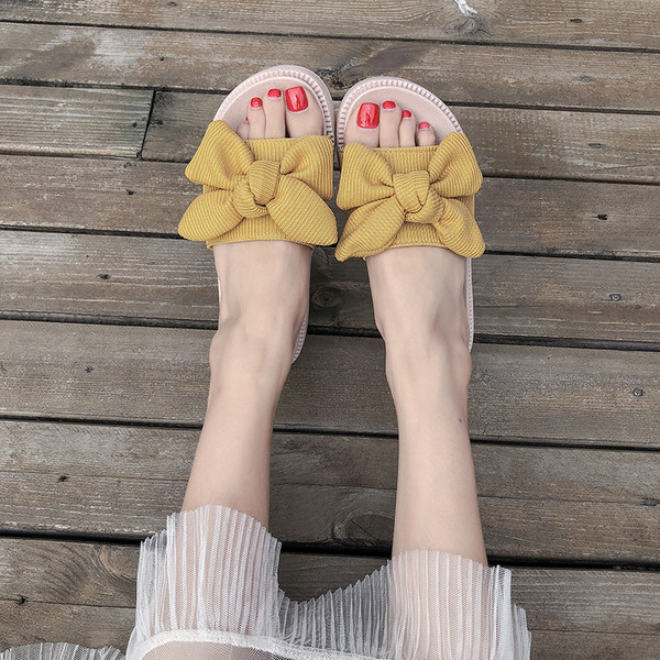 Alkalmi női papucs dekoratív csomóval