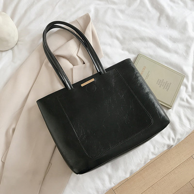 Liela sieviešu soma no eko ādas ar īsiem rokturiem