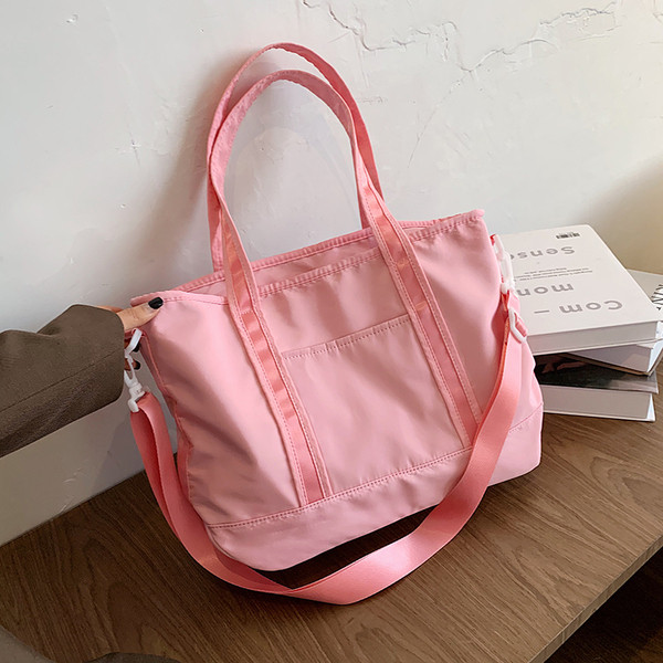 Női sporttáska rövid és hosszú füllel