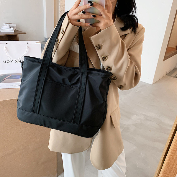 Női sporttáska rövid és hosszú füllel