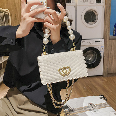 Stilīga rokassomiņa ar akmeņiem un pērlēm