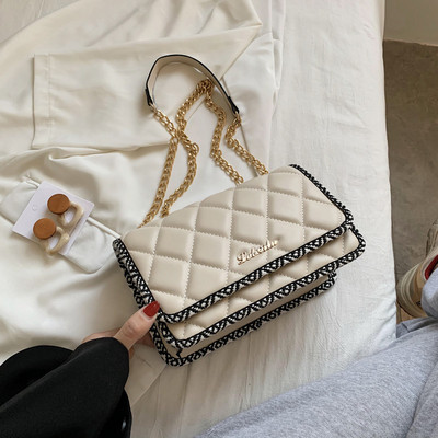 Modern ökobőr táska hosszú fém fogantyúval