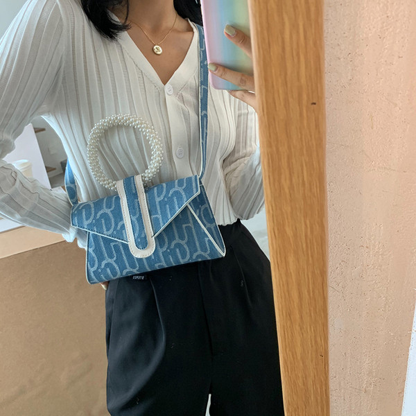 Moderna sieviešu soma ar apaļu rokturi un pērlēm