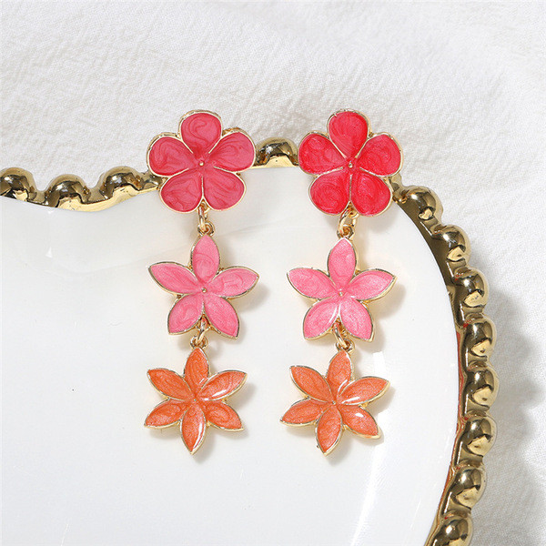 Lógó női fülbevaló virággal