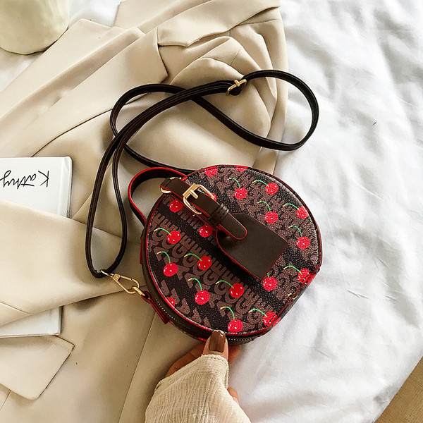 Geantă rotundă de damă elegantă, cu mâner lung