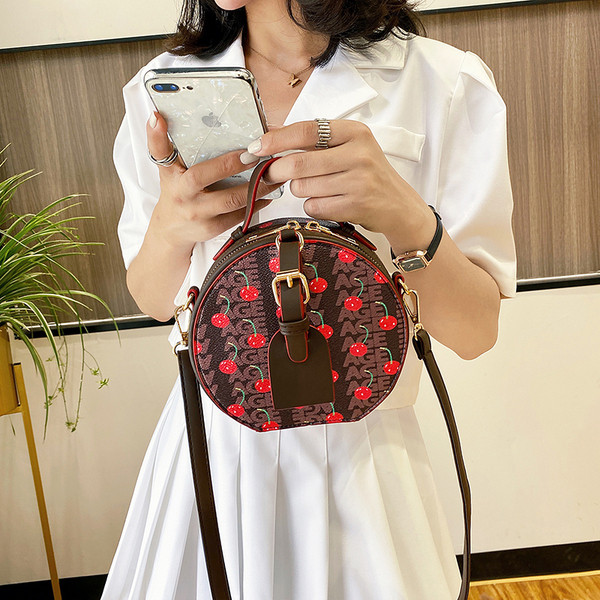 Geantă rotundă de damă elegantă, cu mâner lung