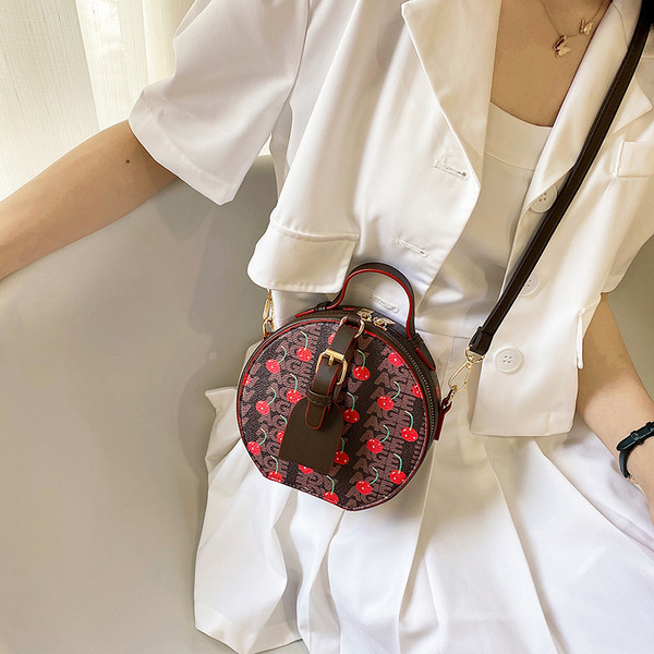 Geantă rotundă de damă elegantă, cu mâner lung