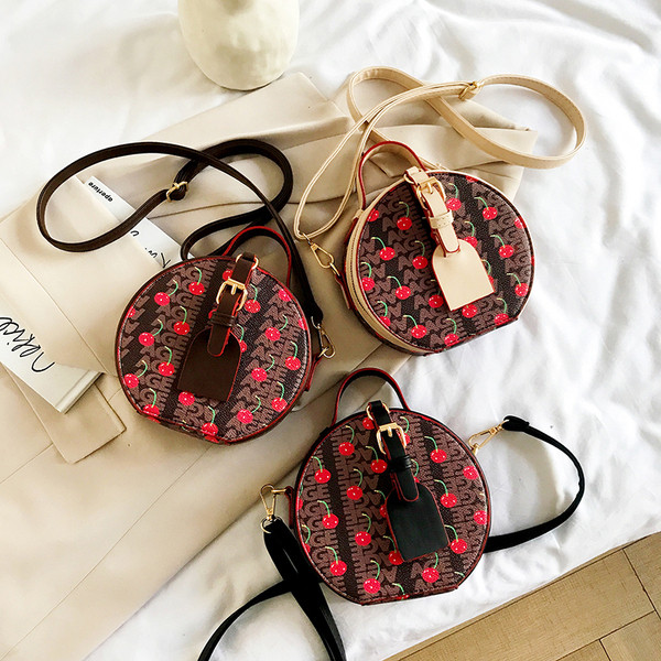 Geantă rotundă de damă elegantă, cu mâner lung