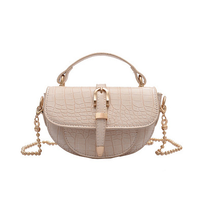 Stílusos női kisméretű műbőr táska fém elemekkel