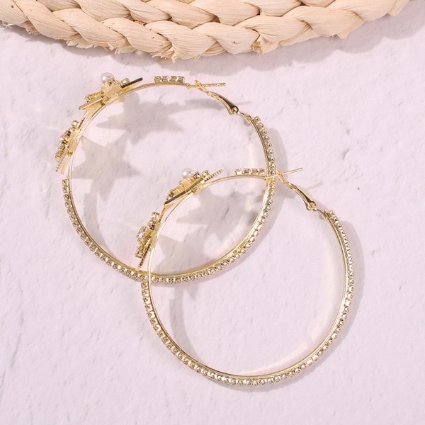 Zeltaini sieviešu apaļi auskari ar zvaigznēm