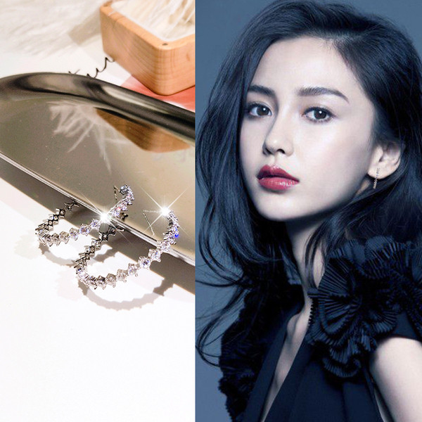 Elegáns női ezüst fülbevaló kerek kövekkel